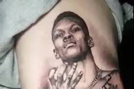 Ufc star israel adesanya is such a big anime freak, he got an insane stomach tattoo inspired by his favorite shows. The Weekly Grind Fan Gets Giant Israel Adesanya Tattoo Max Holloway Pranks Friend Mma Fighting