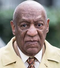 A new prison mug shot shows bill cosby smiling with a disposable mask hanging off his face. Bill Cosby Show Age Wife Biography