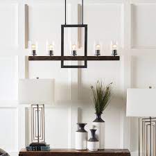 The simple, clean look appeals to almost anyone and blends feminine and masculine influences. Gracie Oaks Odin Transitional Linear 5 Light Candle Style Chandelier Wayfair