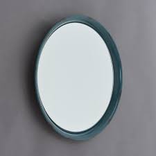 Maybe you would like to learn more about one of these? Charon Blue Round Metal Framed Mirror