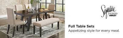 The dining set includes a table and 4 chairs. Amazon Com Signature Design By Ashley Hazelteen Dining Room Table And Chairs Set Of 5 Medium Brown Furniture Decor