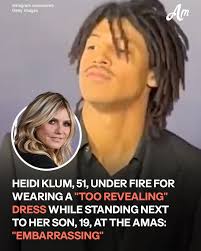 Heidi Klum stole the spotlight in a black dress with risqué  side-slits—while her 19-year-old son Henry stood right beside her. 🤯 #AMAs