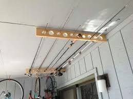 Ceiling Mount Fishing Pole Rack I M Gonna Build One This Weekend Storage Shed Organization Fishing Pole Storage Diy Garage Storage
