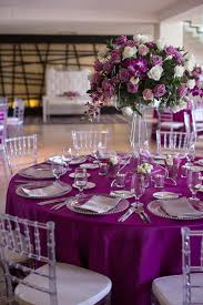 Magenta Tablecloth Clear Chiavari Chairs And Clear Candelabra With Flowers Magenta Wedding Decorations Purple Wedding Theme Wedding Centerpieces