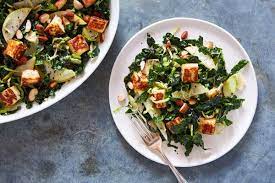 Salty Fried Halloumi Cubes Are The Star Of This Bright Lemony Kale And Brussels Sprouts Salad Crispy Melt Brussel Sprout Salad Brussel Sprouts Sprouts Salad
