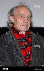 Director Jacques Rivette poses as he arrives to the premiere of his new  film 'Ne Touchez pas a la Hache', held at the 'Centre Pompidou', as part of  a special tribute to