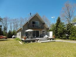 Spacious modernized log cabin location on 120 ft of the sugar sand beach of lake huron. Beauty And The Beach Oscoda Michigan Vacation Rentals Lake Huron Homes Sunrise Side North Eastern Michigan Michigan Vacations Oscoda Michigan Lake Huron