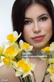 Woman Holding Yellow Daffodils Stock Photo