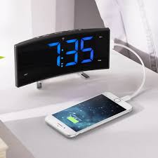Charge your phone with the usb charging port while you sleep. The Easy Read Curved Atomic Alarm Clock Hammacher Schlemmer