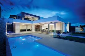 These smart house designs incorporate pools into the overall concepts, in many cases with side courtyards that the layouts wrap around for maximum inside/outside living. Outstanding Homes With L Shape Swimming Pool Design Also White Terrace Combined Black Cabin Architecture House Interior Architecture Design Modern House Design