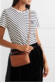 * expertly crafted from classic calfskin. Loewe Mini Puzzle Bag Tan Off 66