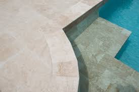 This pool paver is non slip and has excellent thermal characteristics. 12x12 Travertine Pool Coping Ivory Tumbled 1 25