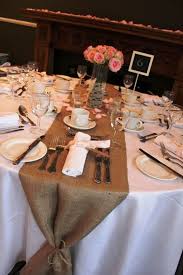 Burlap Table Runners Shown Here With Soft Pink Roses And Napkins Tied With Pink Ribbon And Lace Wedding Table Layouts Wedding Table Linens Wedding Table Pink