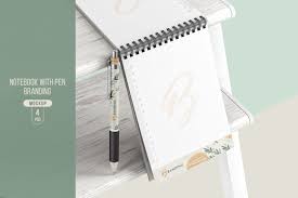Download Notebook With Pen Branding Mockup In Stationery Mockups On Yellow Images Creative Store PSD Mockup Templates