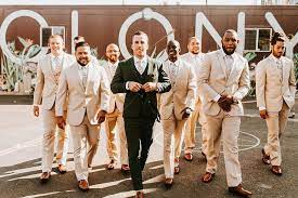 These Two Said Their Vows Under One Of Portlands Most Famous Bridges Tan Groomsmen Tan Groomsmen Suits Wedding Groomsmen Attire