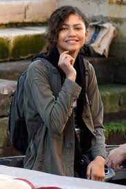 Zendaya and tom holland in spiderman suit swing into action up in the air as they are lifted with wires while filming spiderman Mj Spider Man Far From Home Zendaya Zendaya Style Zendaya Coleman