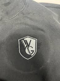 This is my attempt at embroidering over a logo that I also unthreaded. I  used cutaway, 1 layer. Should I have also used a topper of some sort? Any  other advice?