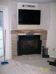 Tv In The Wall Appealing Corner Stone Stacked Fireplace Mantel Audio Furniture Ideas With Black Screened Under Wall Mount Tv Decorating Chimeneas Casas Muebles