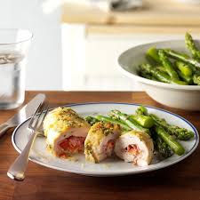The ham and swiss cheese are arranged on top of the chicken breast and rolled together then dredged in bread crumbs. Sage Chicken Cordon Bleu Recipe How To Make It Taste Of Home