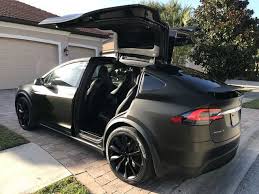 Tesla Model X Black Satin Gold Dust Vinyl Wrap With Carbon Fiber Accents On Chrome And All 6 Seat Backs Voiture Tesla Model X Tesla Roadster