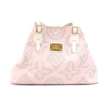 Find a versatile collection of designer handbags for women. Louis Vuitton Louis Vuitton Tahitienne Cabas Gm White Leather X Baby