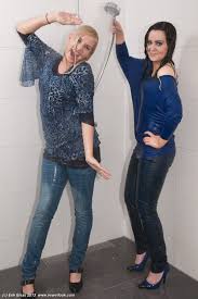 2 Girls Take A Shower In Shirts Jeans And Shoes