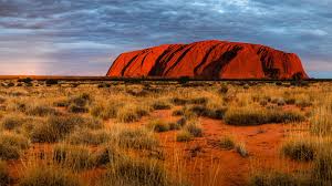 Uluru is australia's most famous rock. Sunset Casts A Deep Orange Glow On Uluru Ayre S Rock Uluru National Park Australia Windows 10 Spotlight Images