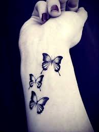 Black And White Butterfly Tattoo Meaning Three Black And White Butterfly Tattoo On Wrist White Butterflies Tattoos In 2020 Butterfly Tattoo White Butterfly Tattoo Butterfly Wrist Tattoo