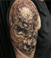 12 Japanese Lion Tattoo Designs And Ideas Petpress Foo Dog Tattoo Japanese Tattoo Designs Foo Dog Tattoo Meaning