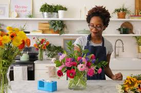 The gold finish of the compote vase inspired the choice of golden mustard roses. Floral Arrangements Flower Frog Diy Hack Apartment Therapy