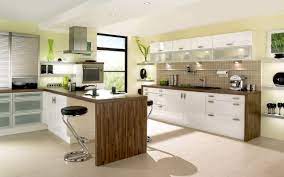Classic kitchen boasts double breakfast island and a round dining table surrounded with green chairs in the corner and by the glass windows. Ideas For Exquisite Built In Kitchen Tables My Decorative