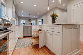 Fieldstone cabinetry crafts overlay and inset cabinetry, by hand, in sioux falls, south dakota. Kitchen Island In Repose Gray With Roll Out Storage Trays By Fieldstone Cabinetry Pendant Lighting Rustic Kitchen Lighting Custom Kitchens Grey Kitchen Floor
