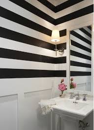 In my first apartment, i painted a 14 foot wall of my exquisite bedroom features white and gray striped walls framing a white canopy bed with quatrefoil. Cool Designer Alert Lynn Morgan Black And White Striped Wall Striped Wall Striped Walls