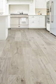 With Subtle Grey Tones And Extra Large Planks Vantage Wood 14mm Laminate Flooring Rock Oak Will Bring An Ele Grey Laminate Flooring Flooring Laminate Flooring
