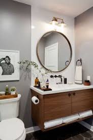 With lowe's wide range, you can share one mirror or have two side by side for a dual sink vanity. Bathroom Lighting Over Round Mirror Trendecors