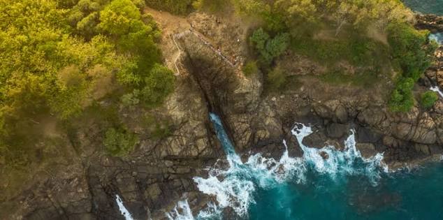 Kudawella Blowhole Point headland sunset rocky coast outrigger canoe east Mirissa Sri Lanka