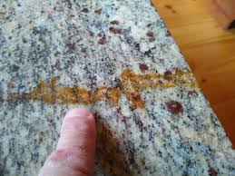 Carefully remove the granite backsplashes, if applicable, by cutting the caulking in the joints that meet the countertop and against the wall. Ask The Builder Dealing With Rust Stains In Granite Countertops The Spokesman Review
