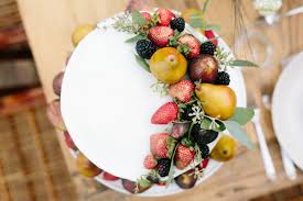 A pumpkin filled with yellow and coral roses. A Dinner Party Menu From Our Autumn Inspired Gathering Food Drink Rip Tan