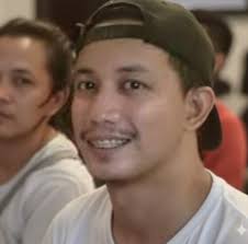 My aunt died in the early 50s leaving 3 children being held by (from left)  my uncle Jose Ong, my father Luis Ong, and my aunt's husband, Hannah Kho.  This was in