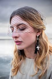 Melissa' Feather & pearl earrings in black