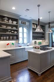 Coastal casual kitchen in gray with a few aqua accents. Remodelaholic Trends In Cabinet Paint Colors
