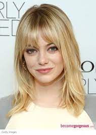 Emma Stone Wears Her Shoulder Length Medium Hair With Lots Of Face Framing Layers And Medium Length Hair With Bangs Layered Hair With Bangs Medium Layered Hair