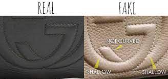 The metal plate that holds the moth is not shiny in a real gucci handbag. Gg Interlocking Details Comparing A Real Vs Fake Gucci Soho Bag Tips On Original Gucci Bags On Sale How To Tell If Gucci Bag Gucci Disco Bag Fake Gucci