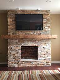 Stone Fireplace With Wrap Around Barn Beam Mantel House Stacked Stone Fireplaces Fireplace Remodel Fireplace