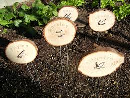 Upcycled canning lid plant markers. Homemade Garden Markers Using Clay Wood And Found Objects Home Grown Fun