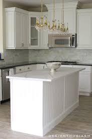 White Painted Cabinets Simplify A Kitchen Renovation Paint Cabinets White White Kitchen Paint Diy Kitchen Renovation