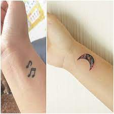You can get temporary music tattoos or watercolor tattoo art before committing yourself to permanent music tattoo designs. Wrist Tattoo Of A Watercolor Style Moon Tattoo Covering