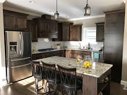 Next, apply at least two coats of protective polyurethane varnish to the cabinets, using a brush or paint sprayer. White Kitchen Cabinets With Dark Tile Backsplash Novocom Top