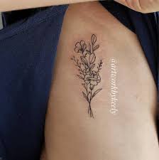 Keely Thurman Tattoo Artist On Instagram A Bundle Of Wildflowers With A Eucalyptus Branch Wildflowerb Tattoos Dainty Tattoos Tattoo Over Scar