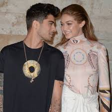 All smiles, zayn malik rocks patched denim for penshoppe's campaign. Why Zayn Malik S New Tattoo Is Sparking Gigi Hadid Engagement Rumors E Online